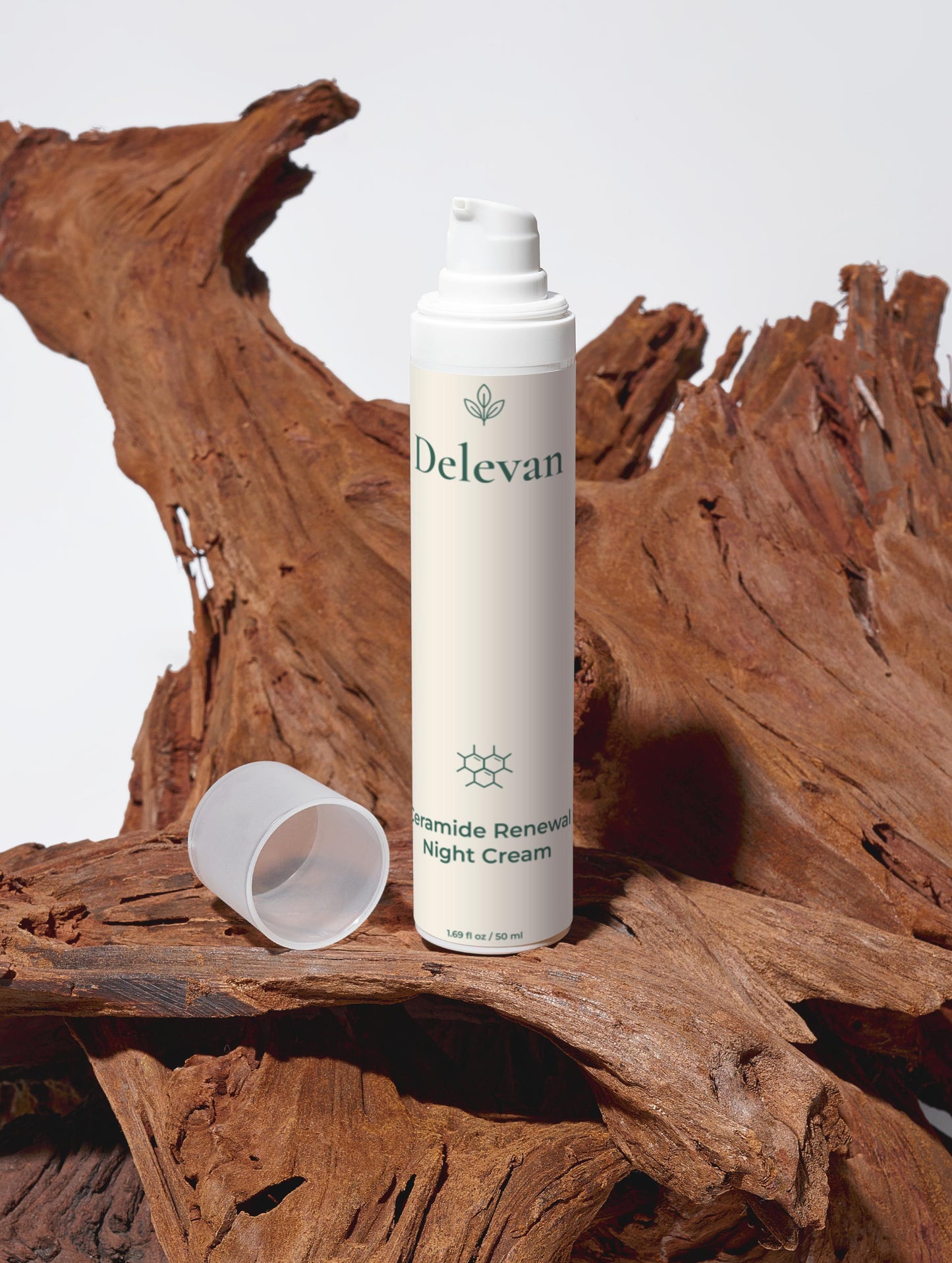 Delevan Ceramide Renewal Night Cream bottle on a stylized wooden surface