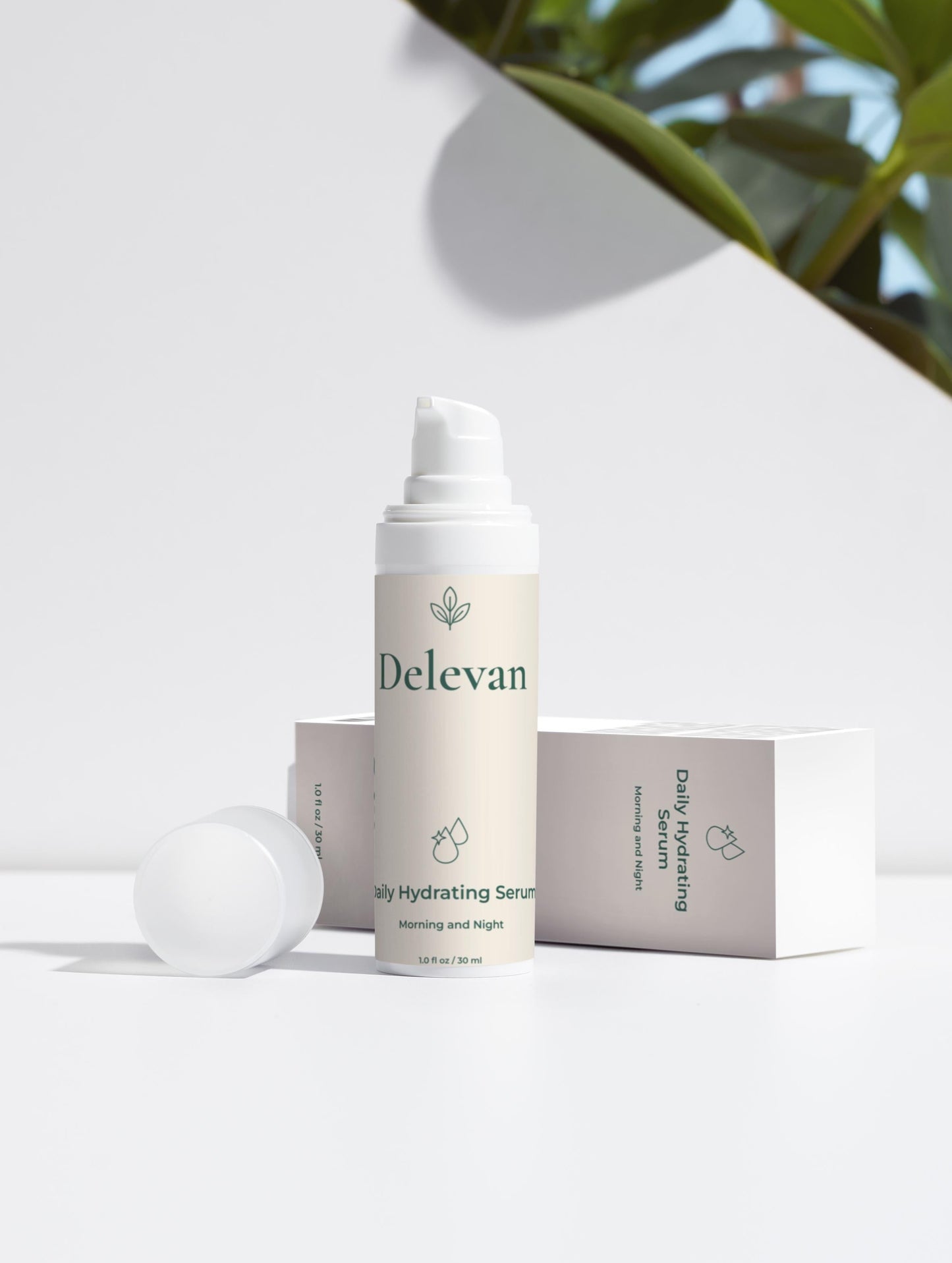 Delevan skincare serum bottle on a white surface with greenery in the background