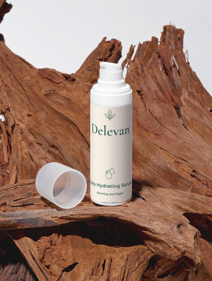 Delevan bottle of hydrating serum on a wooden surface