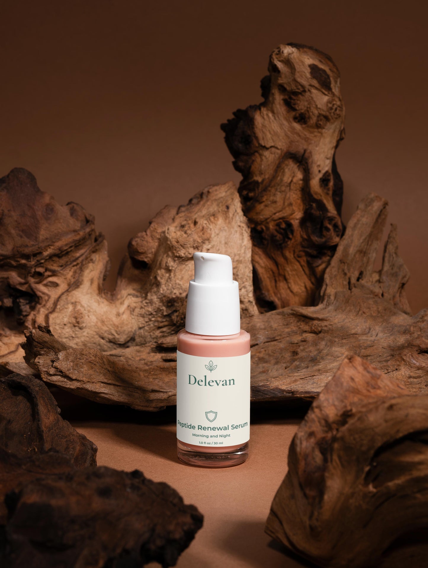 Delevan Peptide Anti-Aging Serum bottle on a brown background with natural wood elements